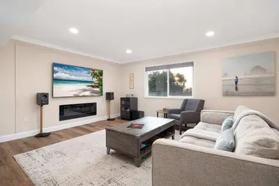 a living room with a couch and a fireplace at Luxury Home OceanView in San Diego