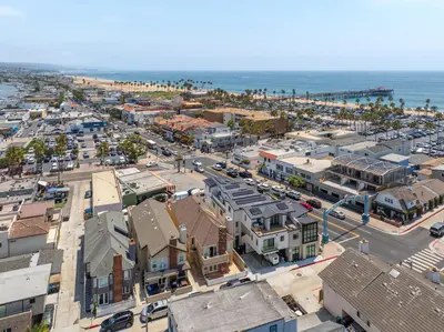 an aerial view of a city with the ocean at Sail & Sea in Newport Beach