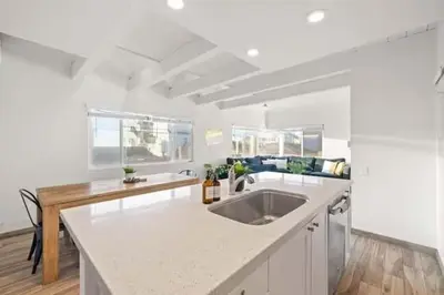 a kitchen with a sink and a counter top at Ocean Views Steps to Beach Rooftop Firepit in San Diego