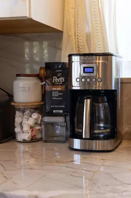a coffeemaker sitting on a kitchen counter with food at 10 min to Beach Central Villa in San Diego
