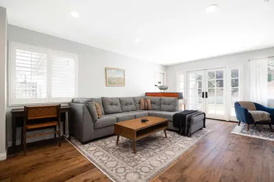 a living room with a couch and a table at 10 min to Beach Central Villa in San Diego