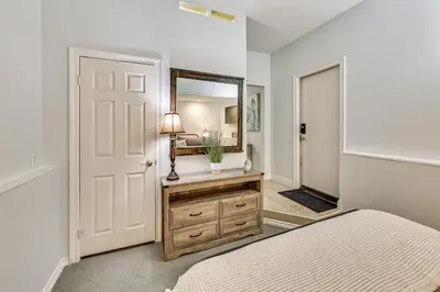a bedroom with a bed and a mirror at Extended-Stay Suite Near I-15 in Lake Elsinore! in Lake Elsinore