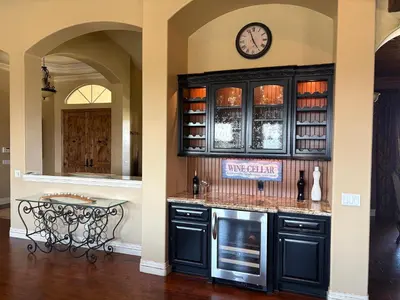 a kitchen with a counter and a clock on the wall at La Bella Vista Estate in Fallbrook