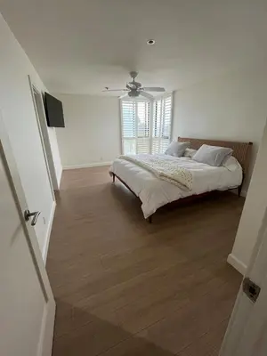 a bedroom with a large bed and a window at Sail Bay Condo in PB Bay View close to the Ocean! 30 day stay is required in San Diego