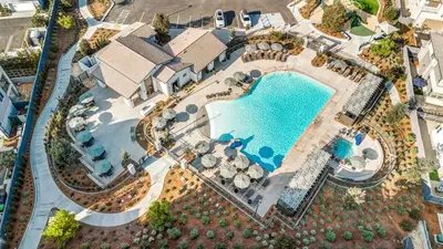 an overhead view of a pool at a resort at Luxury Oasis Resort Pool&Spa Fitness Arcade in Ladera Ranch