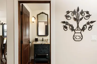 a bathroom with a sink and a mirror at Luxury Point Loma Retreat Pool Spa Views in San Diego
