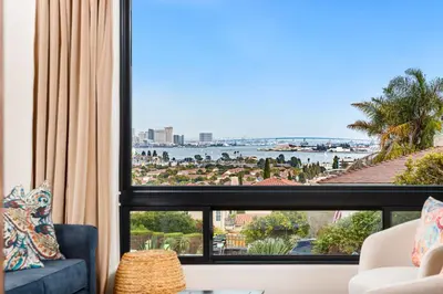 a living room with a view of the ocean at Luxury Point Loma Retreat Pool Spa Views in San Diego