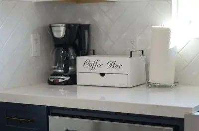 a kitchen counter with a coffee box on top of it at Luxury Bayview Oasis • Pool Spa Games Views in San Diego