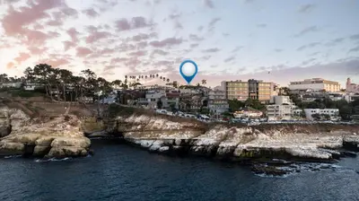 a blue balloon flying over the water near a city at New Modern Studio - Stunning Ocean view in San Diego