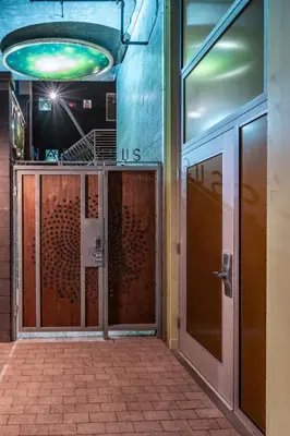 an entrance to a building with a revolving door at Hotel Narcissus - Room 4 in San Diego