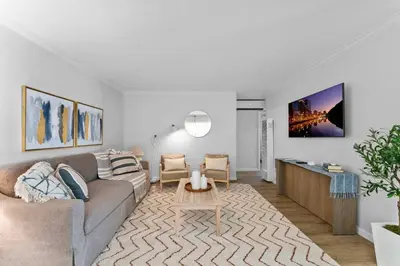 a living room with a couch and a table at Stylish Apartments in Mission Hills with Outdoor Space in San Diego