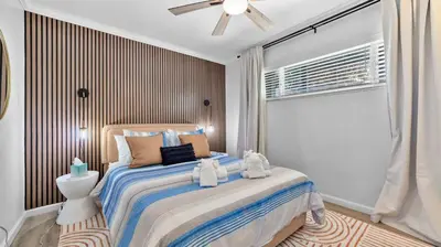 a bedroom with a bed with two teddy bears on it at Chic San Diego Apartment with Hot Tub & Workspace in San Diego