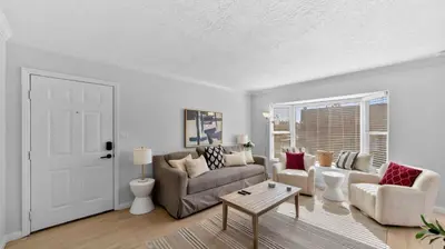 a living room with a couch and a table at Cozy San Diego Hideaway in Historic Mission Hills in San Diego