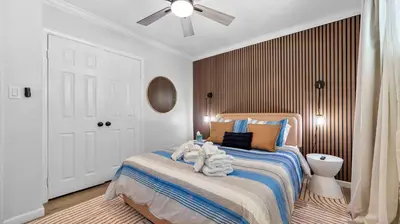 a bedroom with a bed and a ceiling fan at Cozy San Diego Hideaway in Historic Mission Hills in San Diego