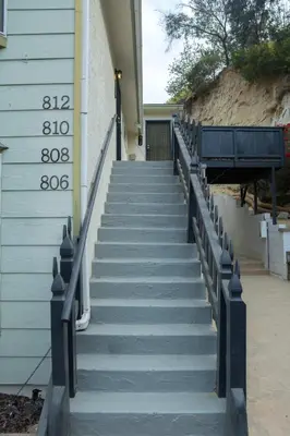a staircase leading up to a building with a thermometer at Cozy San Diego Hideaway in Historic Mission Hills in San Diego