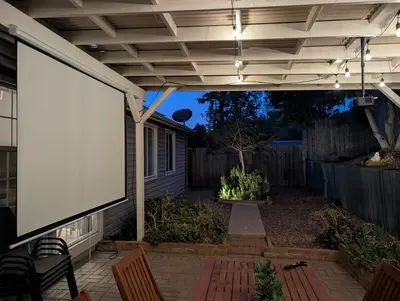 a large screen on the side of a patio at Relax and Recharge here Close to All Attractions in San Diego