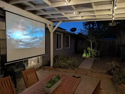 a screened in patio with a large screen at Relax and Recharge here Close to All Attractions in San Diego