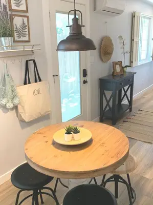 a wooden table and chairs in a room at New cozy studio 2 queen beds kitchen walk to water! in San Diego