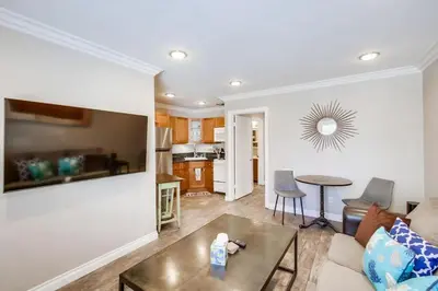 a living room with a couch and a table at Mission Bay Getaway - Walk to the Water in San Diego