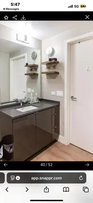 a bathroom with a sink and a mirror at Janna hospitality in San Diego
