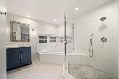 a white bathroom with a tub and a shower at Coastal Elegance by the Shore in San Diego