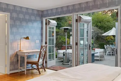 a bedroom with a bed and a desk at Coastal Elegance by the Shore in San Diego