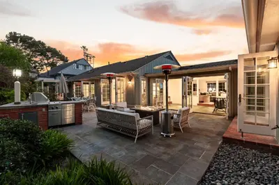 a backyard patio with a bar and a kitchen at Coastal Elegance by the Shore in San Diego