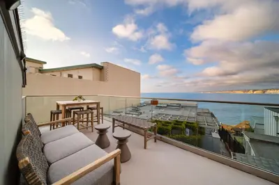 a balcony with a view of the water at Terrace Views at La Jolla Cove in San Diego