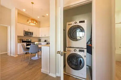 a kitchen and living room with a washer and dryer at Luxury Living in N Park, 2BR, King Beds, Parking in San Diego