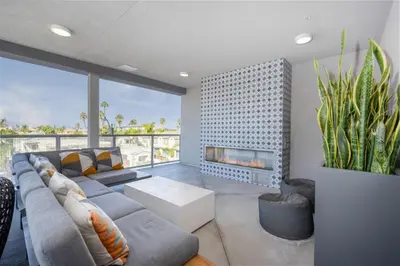 a living room with a couch and a fireplace at Luxury Living in N Park, 2BR, King Beds, Parking in San Diego