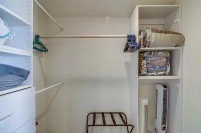 a refrigerator door is open with a chair in it at Stunning beach home located between bay and beach with Ocean View Patio in San Diego