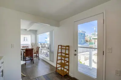 a room with a door leading to a balcony at South Shore Gem with Ocean View, Patio, BBQ in San Diego