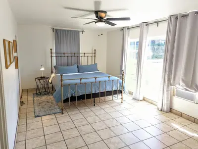 a bedroom with a bed and a ceiling fan at Large 3 Bedroom near everything in San Diego in San Diego