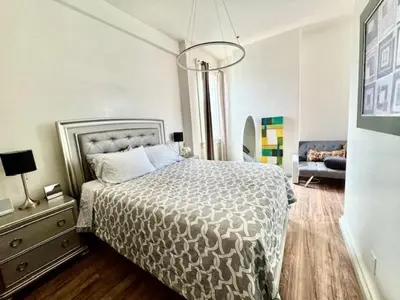 a bedroom with a bed and a couch at Walk everywhere heart Gaslamp in San Diego