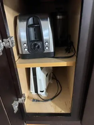 a toaster oven sitting on top of a shelf at Walk everywhere heart Gaslamp in San Diego