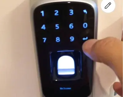 a hand holding a remote control with a button on it at Walk everywhere heart Gaslamp in San Diego