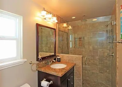 a bathroom with a sink and a shower at Get Your Vitamin Sea! Steps to Sand, Bikes, & Balcony in Newport Beach