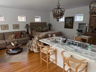 a living room with a table and a couch at La Jolla Carriage House in San Diego