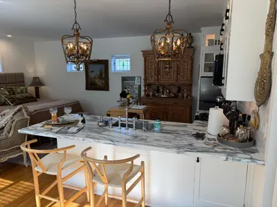 a kitchen with a large marble counter top in a room at La Jolla Carriage House in San Diego