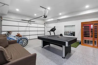 a room with a ping pong table and a couch at Wellness Bnb - Your San Diego Retreat in San Diego