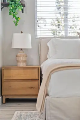 a bedroom with a bed and a nightstand with a lamp at Wellness Bnb - Your San Diego Retreat in San Diego