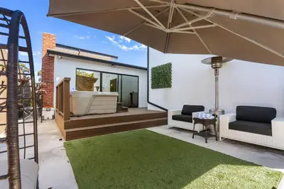 a patio with two chairs and an umbrella at Wellness Bnb - Your San Diego Retreat in San Diego