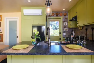 a kitchen with two yellow plates on a counter at Hidden Casita with Private Deck & Patio in San Diego