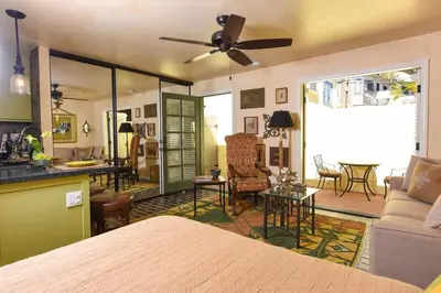 a bedroom with a bed and a living room at Hidden Casita with Private Deck & Patio in San Diego