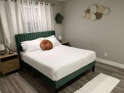 a bed with a brown pillow on top of it at Exotic Home Rexview by SD Stay in San Diego