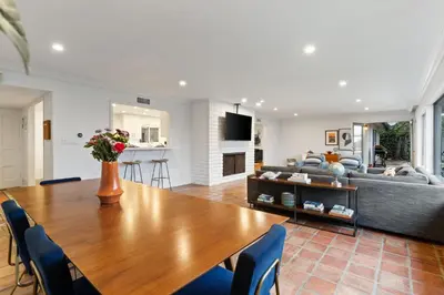 a living room with a table and a couch at Ocean View Retreat Firepit & Spacious Yard in San Diego