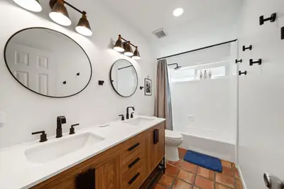 a bathroom with a sink and a shower and a mirror at Ocean View Retreat Firepit & Spacious Yard in San Diego