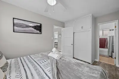 a bedroom with a bed and a ceiling fan at Prime North Park Stay, Walk to Restaurants, Bars, and Breweries with Free Parking in San Diego
