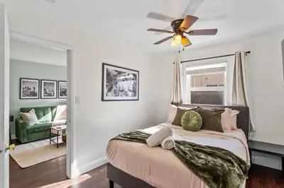 a bedroom with a bed with a ceiling fan at Colorful & Cozy Oasis in North Park Walk to Restaurants, Bars, and Breweries in San Diego