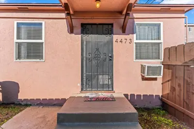 a house with a door with graffiti on it at Stylish & Comfy Gem in North Park, Walk to Restaurants, Bars, and Breweries in San Diego